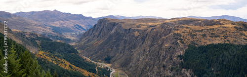 Obraz na plátně Panoramic scenery of New Zealand's natural landscape with mountains and Queenstown Hill, and Gorge Road winding between the valleys in the distance