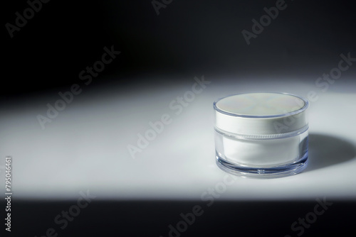 cosmetic cream on a background with shadows and copyspace