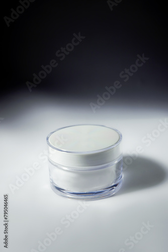 cosmetic cream on a background with shadows