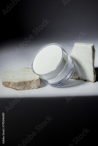 still life of cosmetic cream with marble