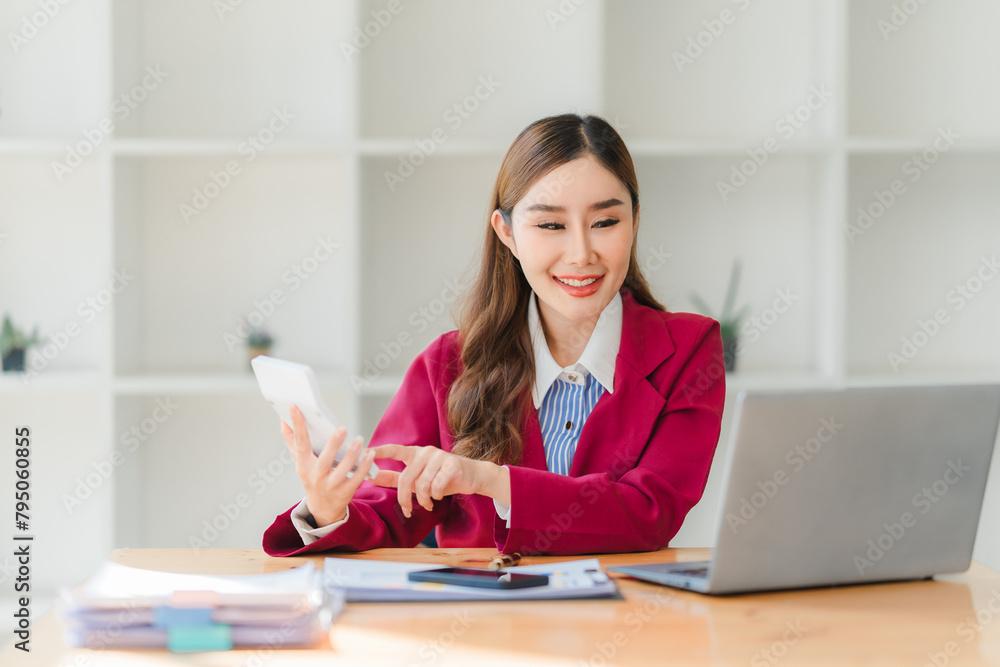 Businesswoman working with financial accounting documents in the office. Businesswoman working with financial accounting documents in the office.