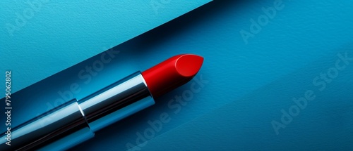 Red lipstick on a blue background photo