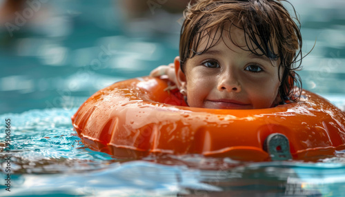 Child in lifebuoy in water