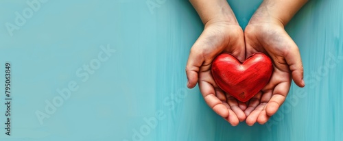 Light blue background, a mother's hand holding a little child's hand with a red heart, viewed from above in a flat layout, with an empty space for text or copy in the center of the composition,  photo
