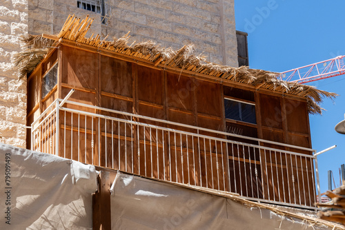 Fotografie Residential buildings in Jerusalem, Israel, during the holiday of Sukkot, in which temporary, wooden structures called a sukkah are placed on streets and balconies during the weeklong festival