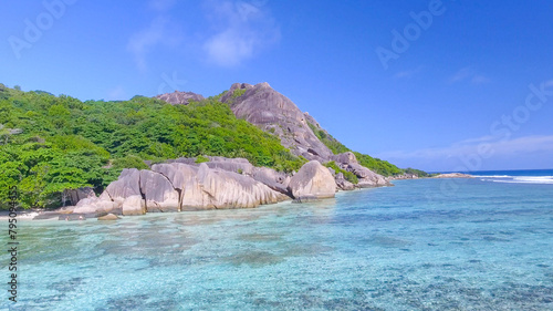 Anse Source D'Argent Beach in La Digue, Seychelles. Aerial view of tropical coastline on a sunny day