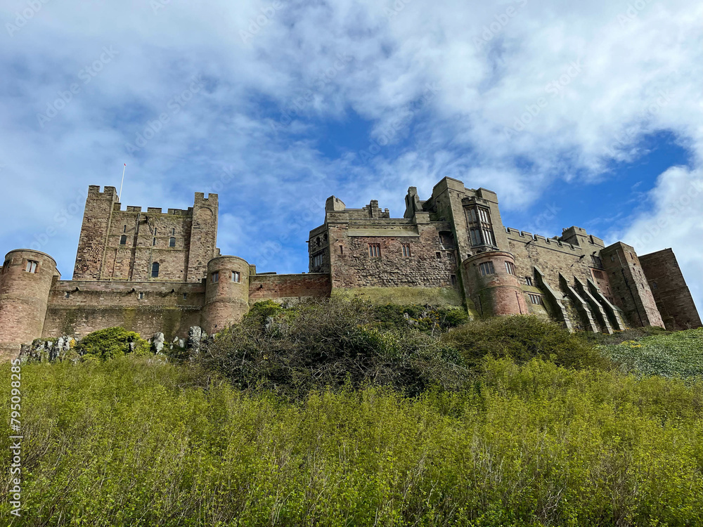 Bamburgh Castle on Bamburgh beach,  Northumberland coastal area, England 