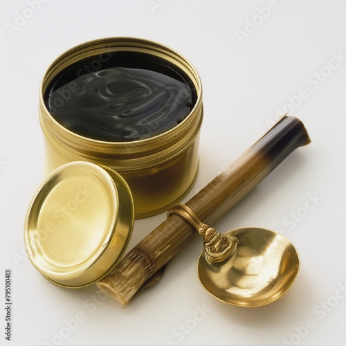 Enjoy the Dark Richness of Molasses in a Tin with a Brass Ladle photo
