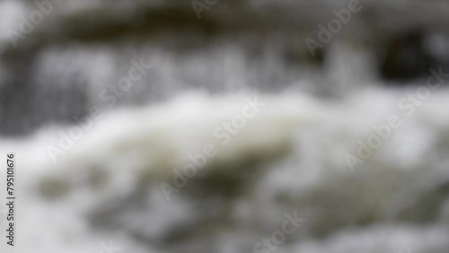 waterfall cresting in summer rack focus