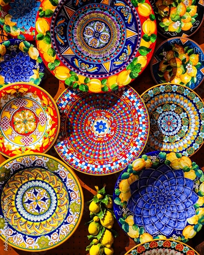 Brightly coloured lemon pattern plates Positano Italy.