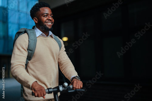Man navigating city on electric scooter (ID: 795103873)