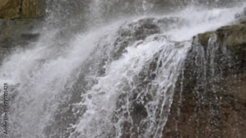 waterfall over rocks in the summer