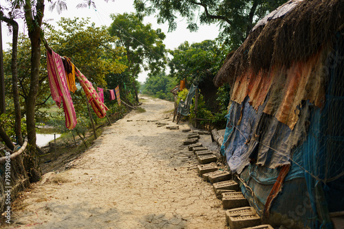 Canvas Print Sundarbans, India - 20 October 2023: an empty unpaved dirt road in a village in rural india