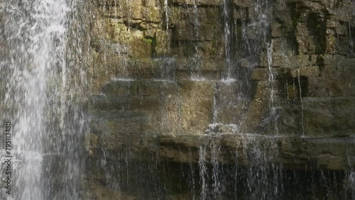waterfall flowing down rocks panning shot