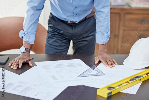 Hands, man and drawing on blueprint in table with pencil for planning a building design, layout and project as architect. Office, construction and engineering person with idea for renovations