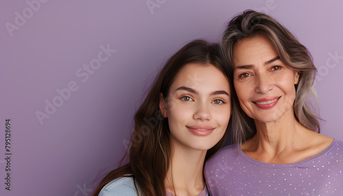 Portrait of young woman and her mother on lilac background with space for text