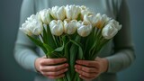 Person Holding Bouquet of White Tulips