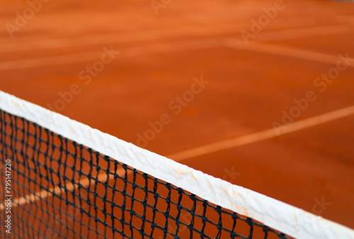 diagonal net of tennis with white stripe in orange clay court, tennis compettion concept