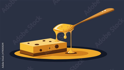 A sful of dark intense honey being drizzled onto a piece of tangy cheese creating a delicious and unexpected flavor combination..
