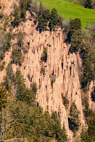 Alpine spring view with the famous earth pyramids near Klobenstein, Ritten, Eisacktal valley, South Tyrol, Italy photo