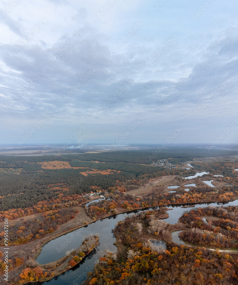 Aerial river valley in autumn colors on riverbank in Ukraine