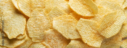 Potato fluted chips. Food background.