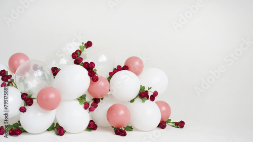 Garland of white balloons and burgundy roses. © July P