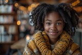 A young girl with a captivating smile, wearing a cozy yellow scarf, in a cafe setting