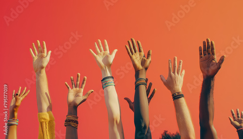 A group of people are holding hands and raising their hands in the air