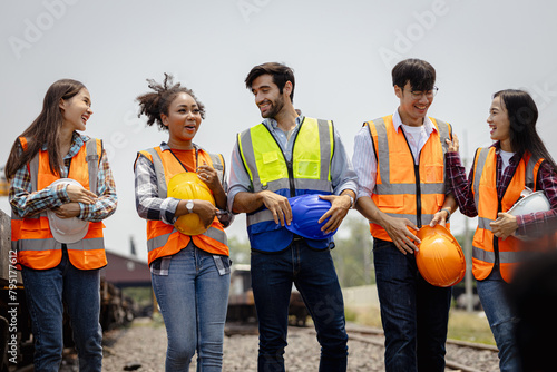 Wallpaper Mural In the Industrial Engineering Facility: Diverse Group of Engineers, Technicians, and Specialists on a Meeting, Have Discussion, Analyse Engine Design Technical Drafts that are Lying on the Table Torontodigital.ca