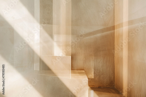 Warm light filters through a window casting long shadows and highlighting architectural details of stairs