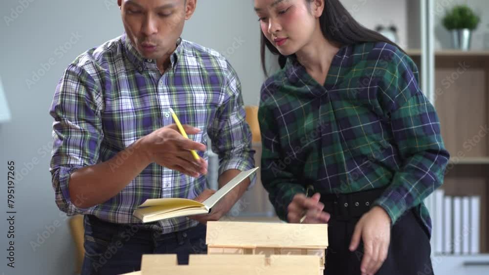 Working as a team architect and designer working on blueprint project of new apartments. Photo concept of work on technical drawings in office.