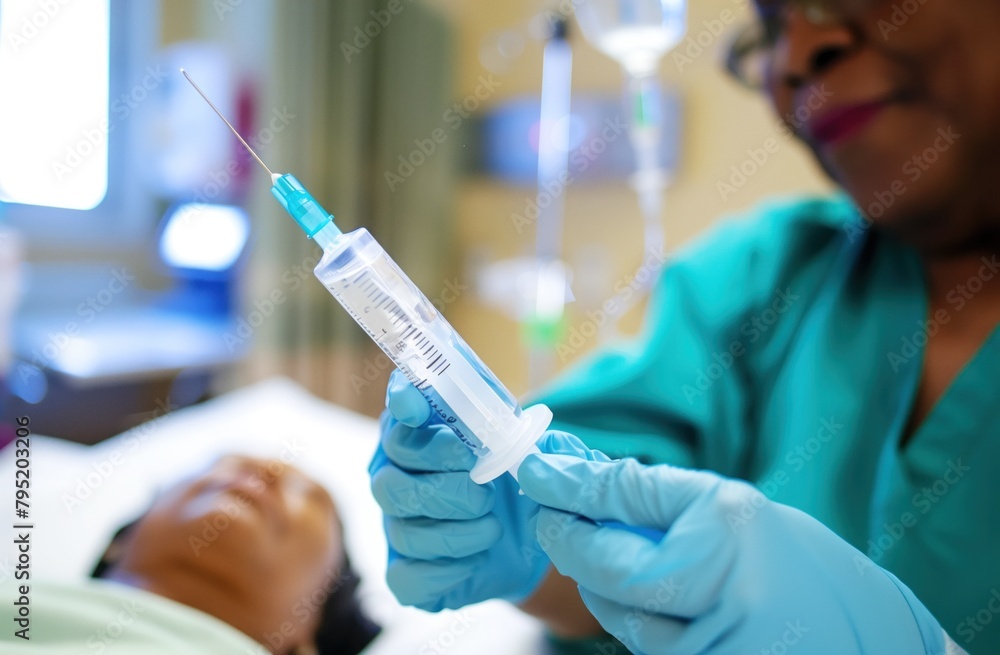 Focused shot of nurse with syringe, patient in background Focused shot of nurse with syringe, patient in background