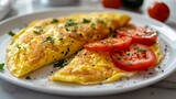 Plate with omelet and tomatoes