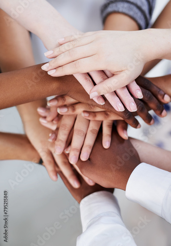 Teamwork, community and hands of diverse people above in circle for unity, corporate partnership and hope. Collaboration, support and equality of employees meeting for cooperation, growth and goals