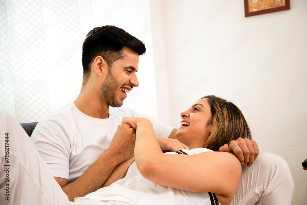 Brunette Couple Smiling And Looking At Each Other While Holding Hands
Brunette Couple Smiling And Looking At Each Other While Holding Hands