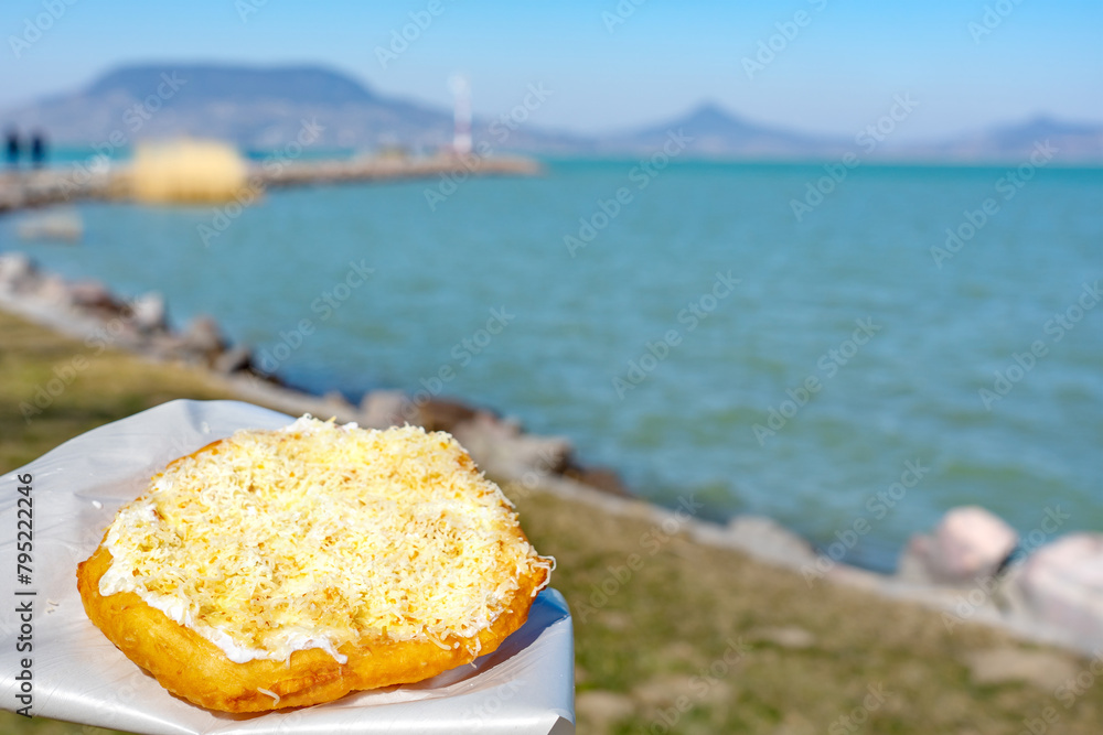 Εκτύπωση καμβά typical hungarian lake Balaton food langos with lake background in Fonyod