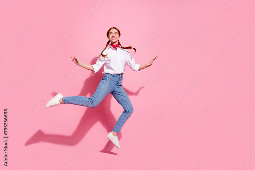 Full length photo of dreamy cute lady dressed cowboy outfit jumping high emtpy space isolated pink color background