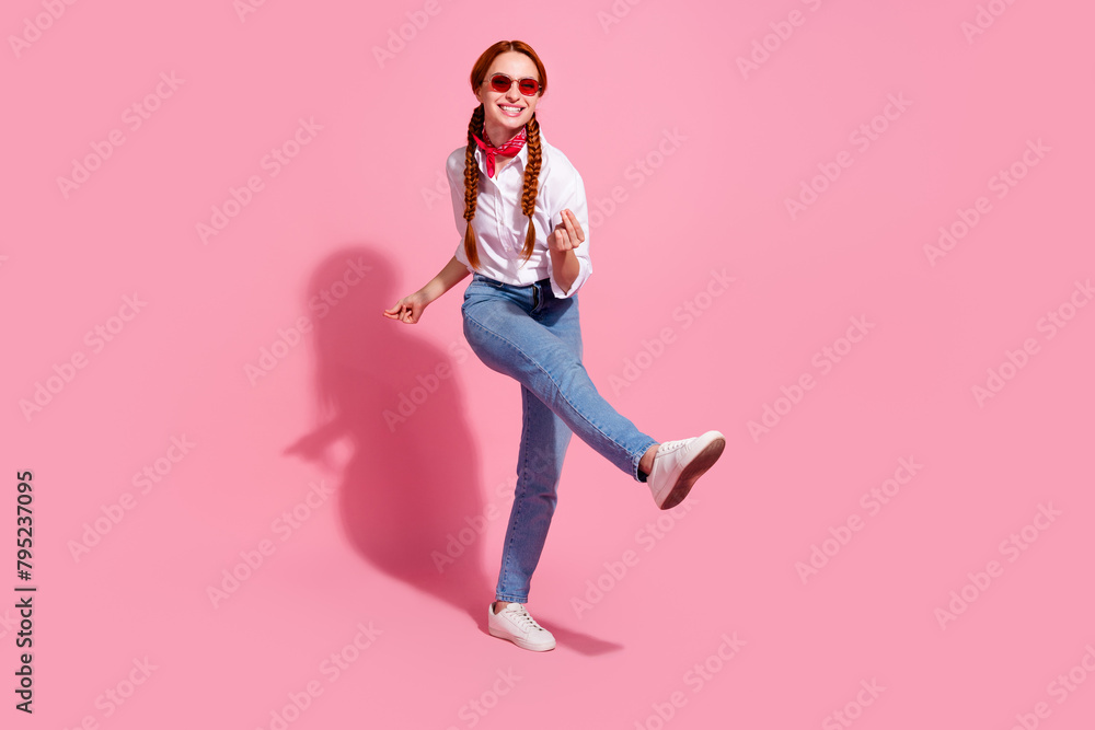 Full length photo of cheerful funky lady dressed cowboy outfit dark red eyewear having fun isolated pink color background