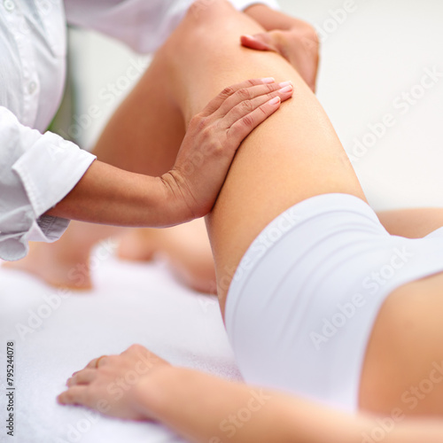 Woman, spa and leg massage for physiotherapy, health and physical therapy for wellbeing break. Lady, detox and muscle treatment for body care, stress relief and zen for peaceful beauty or skincare © peopleimages.com