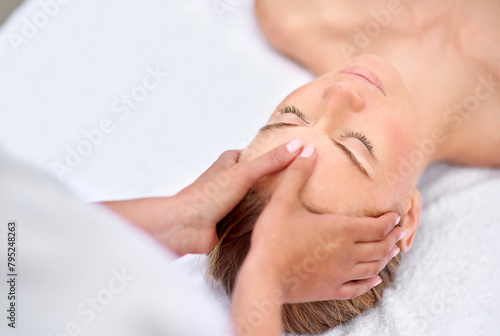 Woman, hands and facial massage or masseuse for treatment, cosmetics and beauty therapy. Female person, relax and serene or dermatology, skin care detox and rest at spa for peace or zen and calm