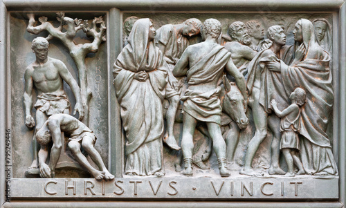 MILAN, ITALY - SEPTEMBER 16, 2024: The relief of Martyrdom of St. Protasius on the bronze gate of Cathedral - Duomo by Arrigo Minerbi (1937 - 1948)