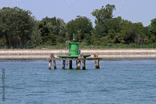 Green Light Beacon Lighthouse in Harbour Canal Near Venice