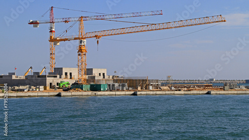Two Cranes at Seawall Construction Site Floods Protection in Venetian Lagoon