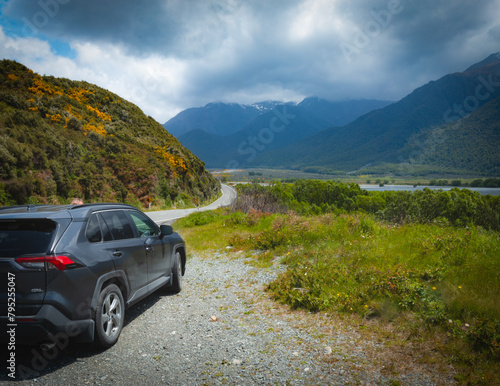 Car on the road in the mountains amongst beautiful scenery