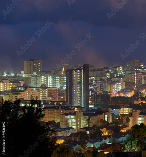 City, skyline and night with clouds, landscape or light for holiday location or outdoor journey. Miami, sunshine or infrastructure for road trip, travel or urban cityscape for scenic view and tourism © peopleimages.com