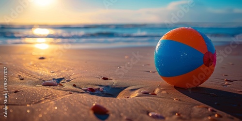 Colorful beach ball resting on the sandy shore, inviting fun and relaxation under the sun.