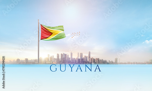 Guyana national flag waving in beautiful building skyline.