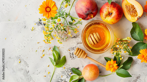 Composition with bowl of honey ripe fruits flowers and