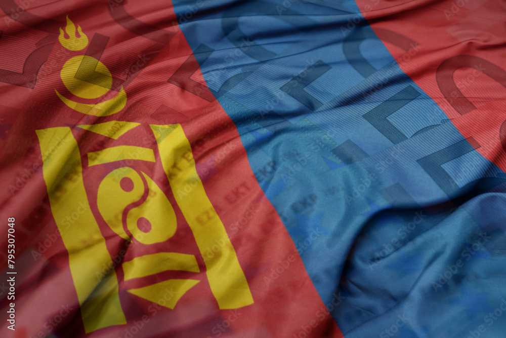 waving colorful national flag of mongolia on a euro money banknotes background. finance concept.